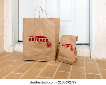 NORTH PORT, FLORIDA - AUGUST 10, 2022 : Outback Steakhouse Take Out Food Order Delivered To Home Doorstep.