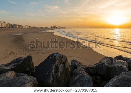 North Sea beach of Oostende at golden hour sunset, Belgium.