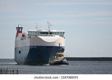 North Shields, England - August 6 2022: Nordic Ace Car Transport Vessel Entering Mouth Of River Tyne Supported By Pilot Tug Vessels