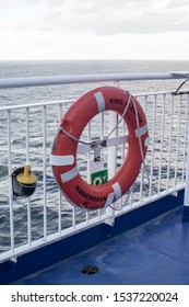 North Shields / Great Britain - September 11, 2019 : Lifesaver Bouy On The Railings Atthe Side Of A Ship Ferry With Sea In Background