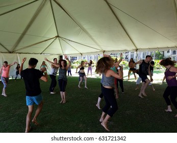 NORTH SHORE, HAWAII - FEBRUARY 26: People Dance Outdoor Under A Tent During Ecstatic Meditation Dancing Class At Wanderlust Yoga Event On The North Shore, Hawaii On February 26, 2017.