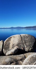 North Shore Lake Tahoe In November Across Beautiful Blue Water With Interesting Rocks In The Foreground