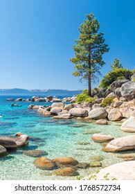 North Shore Of Lake Tahoe Secret Harbor With Giant Granite Boulders In Clear Blue Turquoise Water On A Bright Sunny Day 