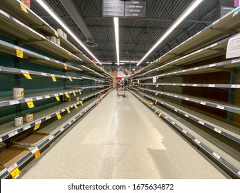 NORTH VANCOUVER, BC, CANADA - MAR 15, 2020: Shelf At A Supermarket Mostly Empty With Only A Few Packages Of Toilet Paper Left Amid Panic Buying As The Coronavirus Spreads.