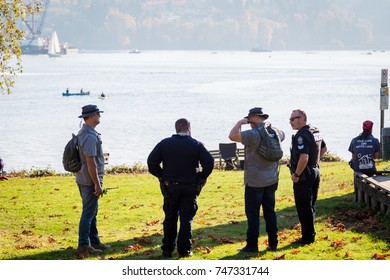 NORTH VANCOUVER, BC, CANADA - OCT 28, 2017: North Vancouver RCMP Standing Watch Over The Kinder Morgan Pipeline Protest At Cates Park. 