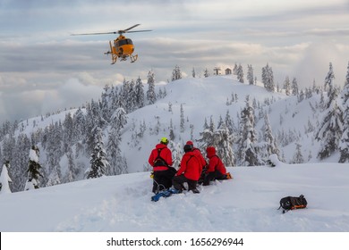 North Vancouver, British Columbia, Canada. North Shore Search and Rescue are rescuing a man skier in the backcountry of Seymour Mountain with a helicopter in winter during sunset. - Shutterstock ID 1656296944
