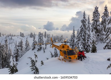 North Vancouver, British Columbia, Canada - Feb 17, 2020: North Shore Search And Rescue Are Rescuing A Man Skier With A Broken Leg In The Backcountry Of Seymour Mountain With A Helicopter In Winter.