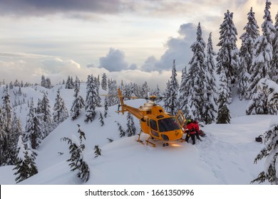 North Vancouver, British Columbia, Canada - Feb 17, 2020: North Shore Search And Rescue Are Rescuing A Man Skier With A Broken Leg In The Backcountry Of Seymour Mountain With A Helicopter In Winter.