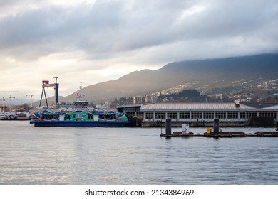 North Vancouver, British-Columbia-Canada - 03-02-2022: View Of  The SeaBus Terminal At Lonsdale Quay. The New Burrard Chinook Vessel Which Is Decorated In First Nations Art Work