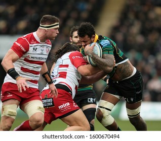 Northampton, UK. 28th December 2019. Courtney Lawes Of Northampton Saints Is Tackled By Gloucester's Josh Hohneck