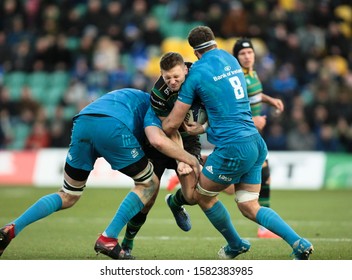 Northampton, UK. 7th December 2019. Dan Biggar Of Northampton Saints Is Tackled By (l-r) Devin Toner And Caelan Doris Of Leinster