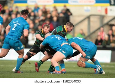 Northampton, UK. 7th December 2019. Alex Waller Of Northampton Saints Is Tackled By Andrew Porter And Rhys Ruddock