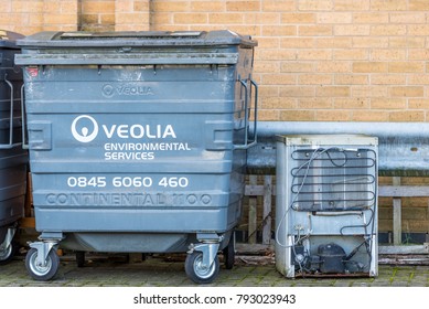 Northampton UK December 09, 2017: Veolia Enviromental Services Logo On Waste Commercial Bin With Recycled Fridge Freezer In Brackmills Industrial Estate