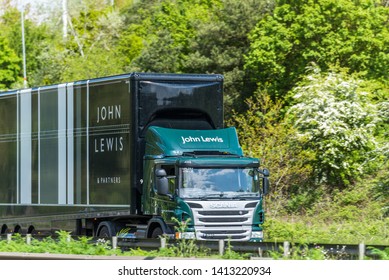 Northampton, UK - May 10th 2019: scania john lewis box truck on uk motorway in fast motion