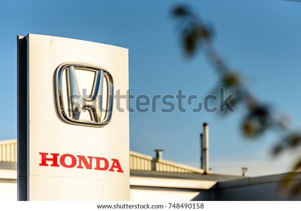 Northampton, UK - Oct 25, 2017: Day view of Honda\
logo at Riverside Retail\
Park.
