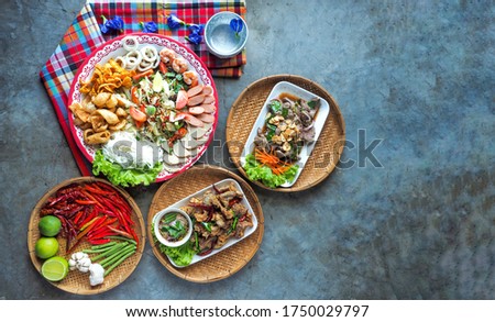 Northeastern Thai food, spicy flavor  On the cement table background