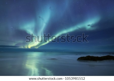 Northen light under mountains. Beautiful natural landscape in the Norway