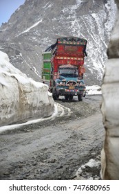 Northern area of Pakistan, May 14, 2014 : Cargo truck is turning on a rocky and slippery road towards to final destination in the snow