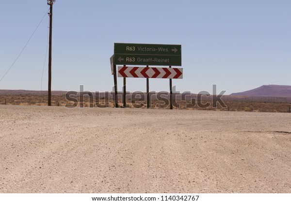 Northern Cape, Circa, December 2017. A
signboard at a T Junction  on a gravel
road.