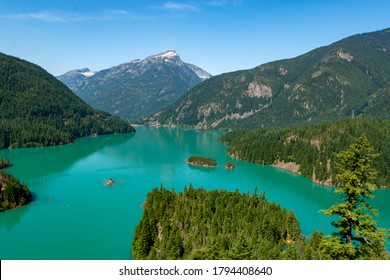 Northern Cascades Pacific Northwest Mountain Range Washington, USA  - Surreal Natural Landscape Of Turquoise Lake Water, Dam And Mountains