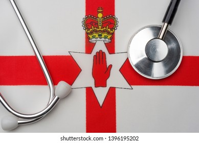 Northern Ireland flag and stethoscope. The concept of medicine. Stethoscope on the flag in the background.