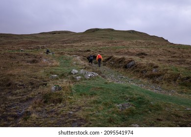 Northern Ireland, UK, December 6, 2021. People Hiking In The Mountains