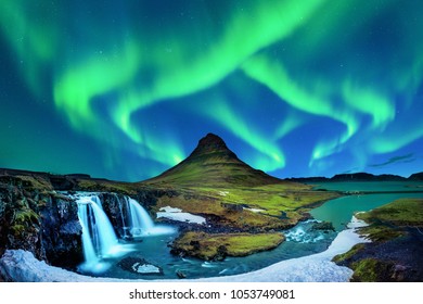 Northern Light, Aurora borealis at Kirkjufell in Iceland. Kirkjufell mountains in winter.