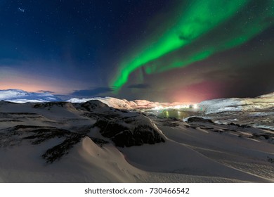 Northern lights above the fjord in Norway.