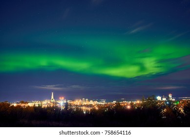 Northern Lights Above Reykjavik In Iceland At Night