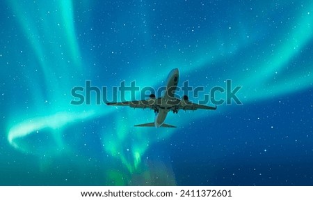 Northern Lights or Aurora Borealis with commercial passenger airplane