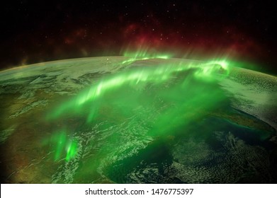 Northern lights aurora borealis over planet Earth "Elements of this image furnished by NASA" close up - Powered by Shutterstock