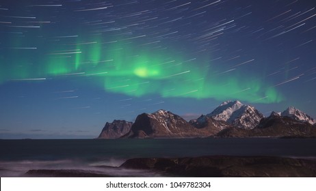 Northern Lights, Aurora Borealis With Star Trails Over The Rocky Mountains, Scenic Night Landscape, Lofoten Islands, Norway