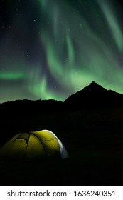 Northern Lights In Norway. Camping Under Polar Norhtern Light In Lofoten Islands