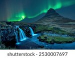 Northern lights over Kirkjufell at night in the autumn of Iceland.