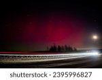 The Northern Lights are red. Rethinking the northern Lights using other colors. A rare image of the red Aurora borealis (Northern Lights). Selective focus.