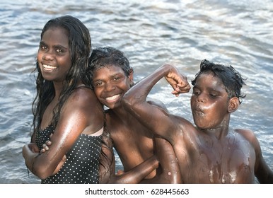 NORTHERN TERRITORY, AUSTRALIA - JANUARY 15 2009: Aboriginal Kids Washing Themselves In The River In Arnhem Land, Northern Territory, Australia.