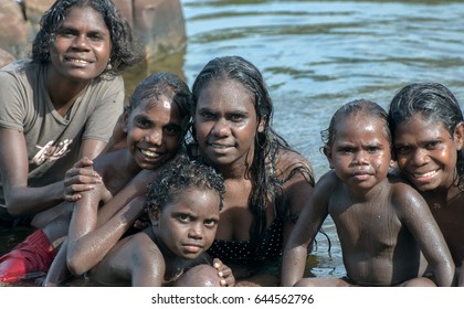 NORTHERN TERRITORY, AUSTRALIA - JANUARY 15 2009: A group of Aboriginal kids washing themselves in the river in Arnhem land, Northern Territory, Australia.