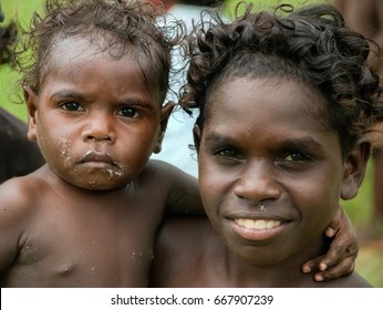 NORTHERN TERRITORY, AUSTRALIA - JANUARY 15 2009 : An Aboriginal Boy Holding His Baby Brother In Northern Territory, Australia