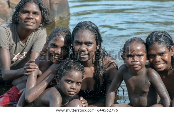 NORTHERN TERRITORY, AUSTRALIA - JANUARY 15\
2009: A group of Aboriginal kids washing themselves in the river in\
Arnhem land, Northern Territory,\
Australia.