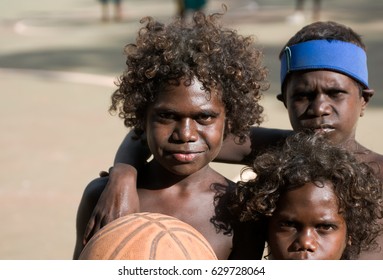 NORTHERN TERRITORY, AUSTRALIA - JUNE 11 2009: Aboriginal kids playing basketball in Arnhem land, Northern Territory, Australia.