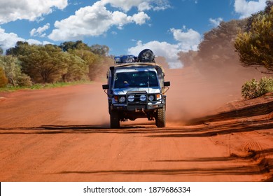 Northern Territory, Australia-July 2020: Close Up View Of Four Wheel Drive Car Throwing Up Red Dust In The Outback Northern Territory, Australia