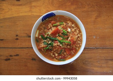 northern Thai meat and tomato spicy dip sauce, usually eat with fresh vegetables. Thai food. also called "nam-phrik-aawng" or "nam-prik-ong"