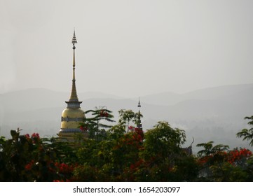 Northern Thai Pagoda In Distant, A Smoggy Sky