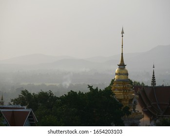 Northern Thai Pagoda In Distant, A Smoggy Sky