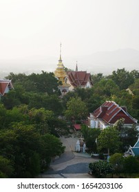 Northern Thai Pagoda In Distant, A Smoggy Sky