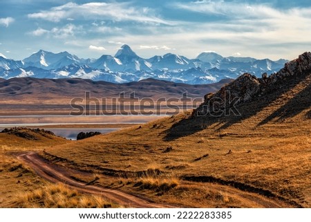 Northern Tien Shan mountain range with Khan Tengri peak in southeast Kazakhstan under a cloudy sky Stock photo © 