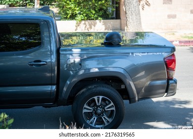 Northridge, California, United States -  June 29, 2022: A Black Tactical Helmet From A Multi-agency Task Force Of LAPD Narcotics Detectives Sits On A Pickup Truck Bed On A Community Street.