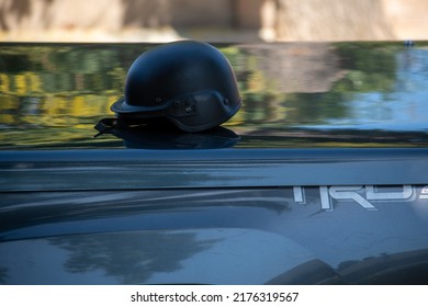 Northridge, California, United States -  June 29, 2022: A Black Tactical Helmet From A Multi-agency Task Force Of LAPD Narcotics Detectives Sits On A Pickup Truck Bed On A Community Street.