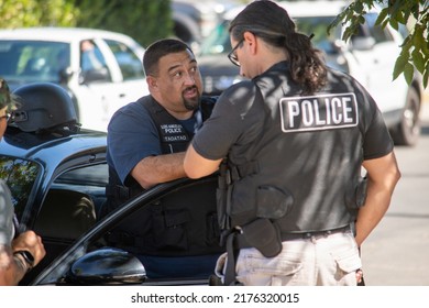 Northridge, California, United States -  June 29, 2022: A Multi-agency Task Force Including LAPD Narcotics Detectives Stages On A Community Street Prior To A Drug Policy Enforcement Raid.