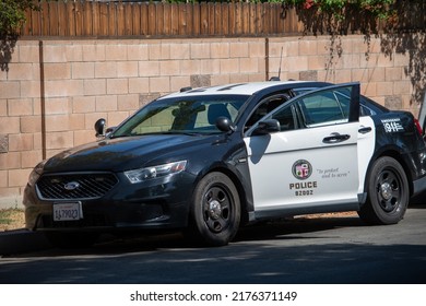 Northridge, California, United States -  June 29, 2022: A LAPD Ford Police Car At The Scene Of A Multi-agency Task Force Including LAPD Narcotics Detectives Staging For A Raid On A Location.